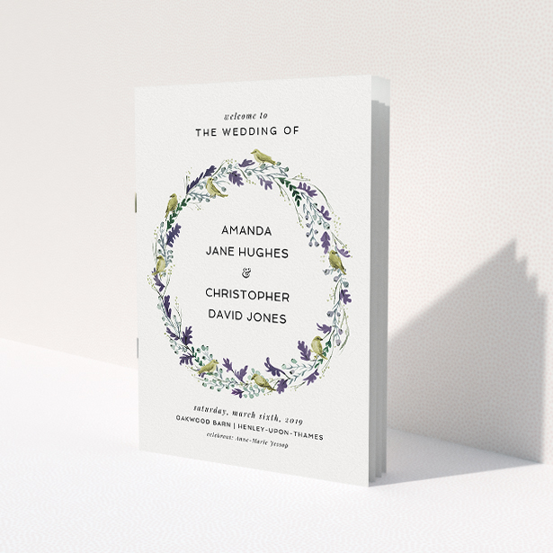 A multipage wedding order of service design titled "Vintage Floral Wreath". It is an A5 booklet in a portrait orientation. "Vintage Floral Wreath" is available as a folded booklet booklet, with tones of off-white and dark green.