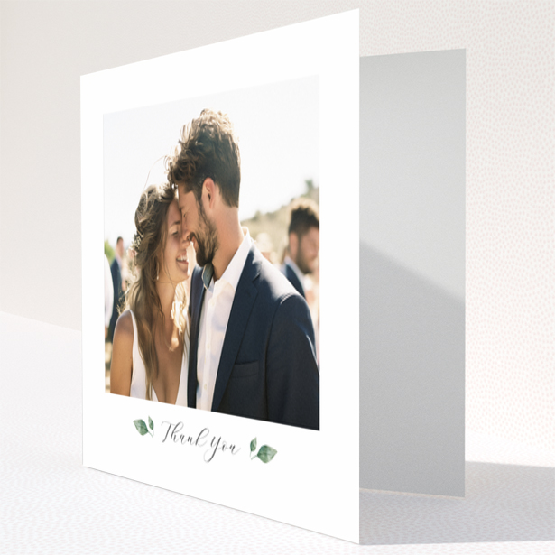 Wedding thank you card with 1 photo featuring a couple embracing and elegant floral accents.