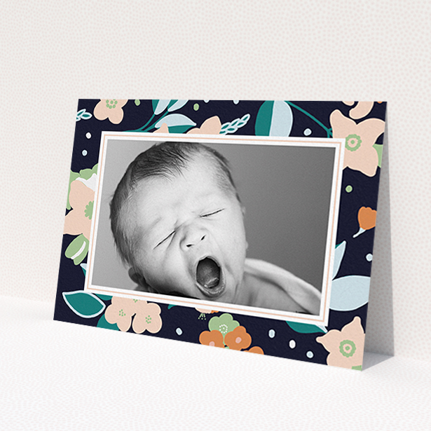A new baby announcement card called 'Bedtime Garden'. It is an A6 card in a landscape orientation. It is a photographic new baby announcement card with room for 1 photo. 'Bedtime Garden' is available as a flat card, with tones of navy blue, pink and orange.