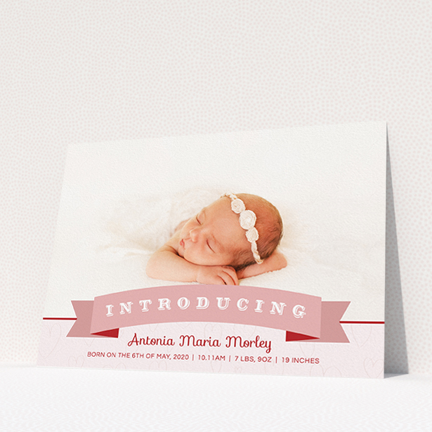 A new baby announcement card named "Big Banner". It is an A5 card in a landscape orientation. It is a photographic new baby announcement card with room for 1 photo. "Big Banner" is available as a flat card, with tones of pink, red and white.
