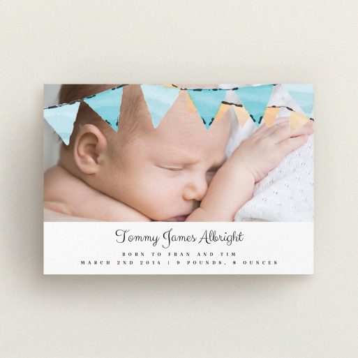 A new baby announcement card design called "Blue Bunting". It is an A6 card in a landscape orientation. It is a photographic new baby announcement card with room for 1 photo. "Blue Bunting" is available as a flat card, with tones of blue and white.