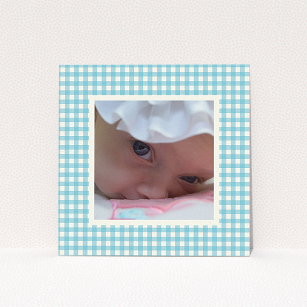 A new baby announcement card named "Blue Plaid". It is a square (148mm x 148mm) card in a square orientation. It is a photographic new baby announcement card with room for 1 photo. "Blue Plaid" is available as a flat card, with tones of blue and white.