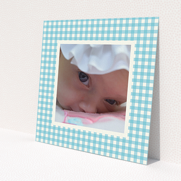 A new baby announcement card named 'Blue Plaid'. It is a square (148mm x 148mm) card in a square orientation. It is a photographic new baby announcement card with room for 1 photo. 'Blue Plaid' is available as a flat card, with tones of blue and white.