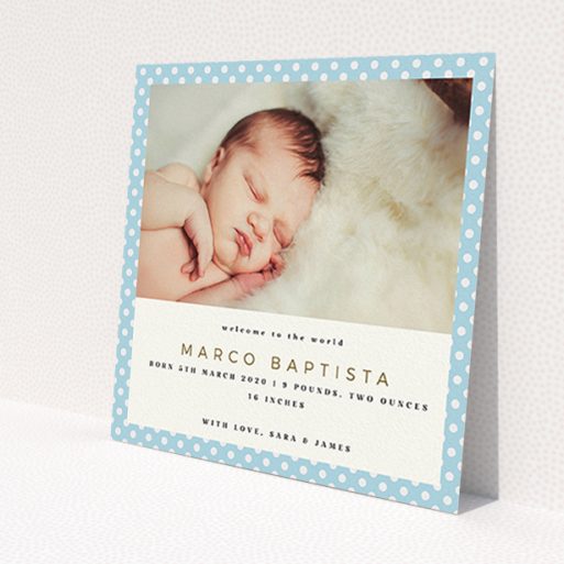 A new baby announcement card design named 'Blue Polkadots'. It is a square (148mm x 148mm) card in a square orientation. It is a photographic new baby announcement card with room for 1 photo. 'Blue Polkadots' is available as a flat card, with tones of blue and white.