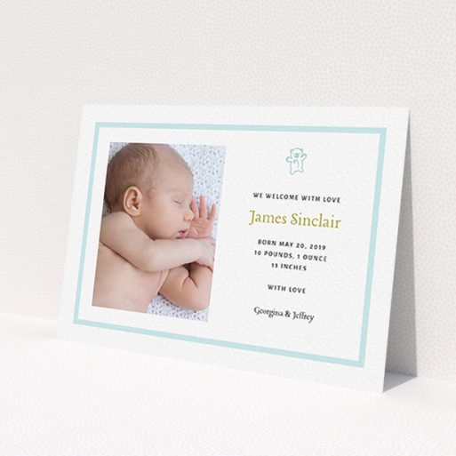 A new baby announcement card called 'Blue Teddy'. It is an A6 card in a landscape orientation. It is a photographic new baby announcement card with room for 1 photo. 'Blue Teddy' is available as a flat card, with tones of blue and white.