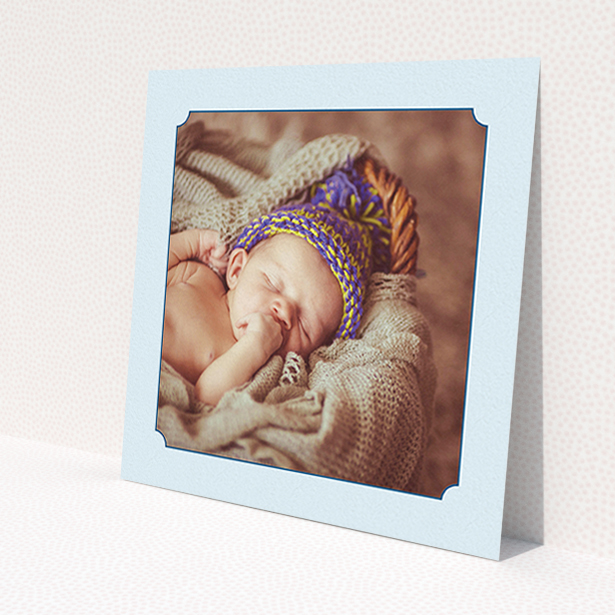 A new baby announcement card design titled 'Classic Frame'. It is a square (148mm x 148mm) card in a square orientation. It is a photographic new baby announcement card with room for 1 photo. 'Classic Frame' is available as a flat card, with mainly blue colouring.