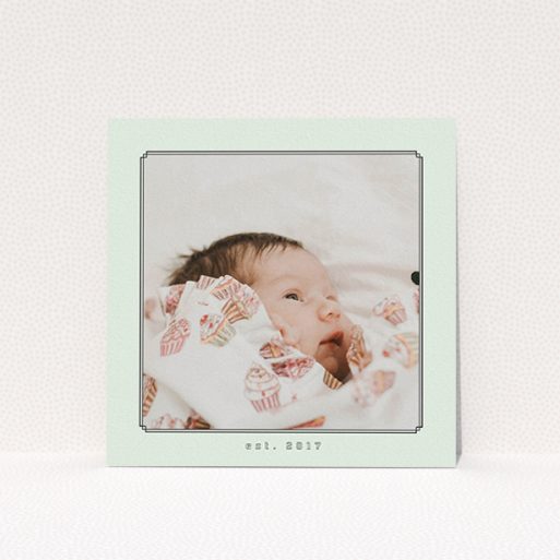 A new baby announcement card template titled "Deco Mint Frame". It is a square (148mm x 148mm) card in a square orientation. It is a photographic new baby announcement card with room for 1 photo. "Deco Mint Frame" is available as a flat card, with mainly green colouring.