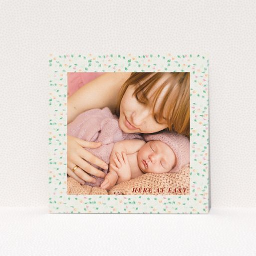 A new baby announcement card design called "Floral abstract". It is a square (148mm x 148mm) card in a square orientation. It is a photographic new baby announcement card with room for 1 photo. "Floral abstract" is available as a flat card, with tones of light cream and green.