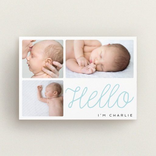 A new baby announcement card template titled "Hello Cursive". It is an A6 card in a landscape orientation. It is a photographic new baby announcement card with room for 3 photos. "Hello Cursive" is available as a flat card, with tones of white and blue.