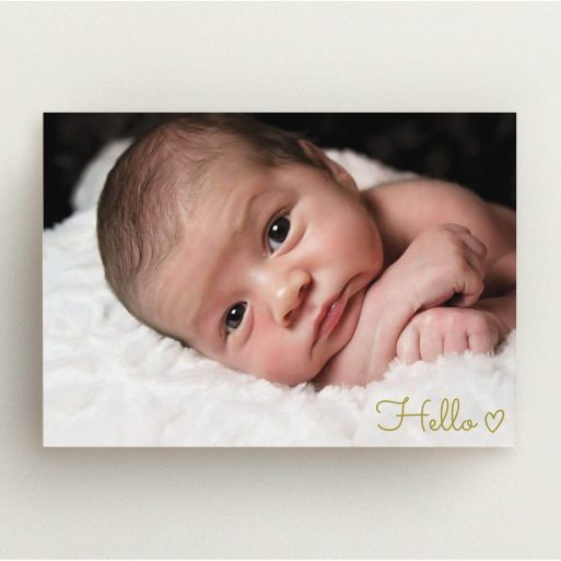 A new baby announcement card design named "Hello". It is an A5 card in a landscape orientation. It is a photographic new baby announcement card with room for 1 photo. "Hello" is available as a flat card, with mainly gold colouring.