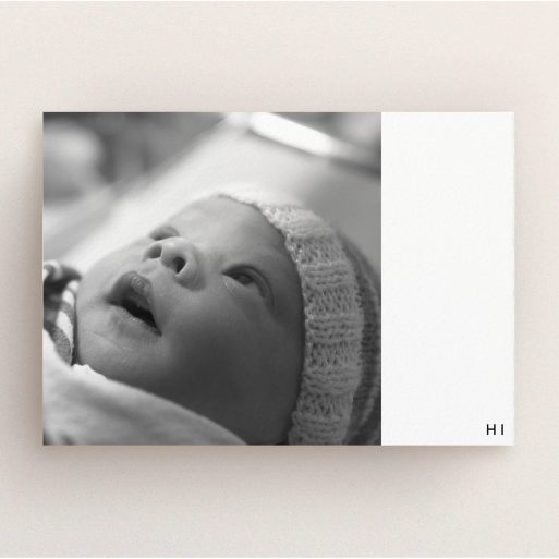 A new baby announcement card design titled "HI". It is an A5 card in a landscape orientation. It is a photographic new baby announcement card with room for 1 photo. "HI" is available as a flat card, with tones of black and white.