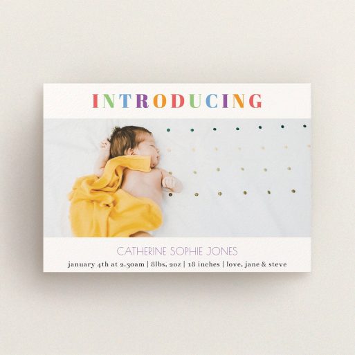 A new baby announcement card named "Introduced in Colour". It is an A6 card in a landscape orientation. It is a photographic new baby announcement card with room for 1 photo. "Introduced in Colour" is available as a flat card, with tones of white and green.