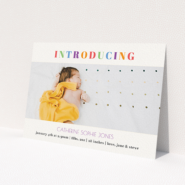 A new baby announcement card named 'Introduced in Colour'. It is an A6 card in a landscape orientation. It is a photographic new baby announcement card with room for 1 photo. 'Introduced in Colour' is available as a flat card, with tones of white and green.