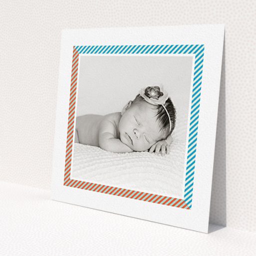 A new baby announcement card template titled 'Kensington Square'. It is a square (148mm x 148mm) card in a square orientation. It is a photographic new baby announcement card with room for 1 photo. 'Kensington Square' is available as a flat card, with tones of white, blue and red.