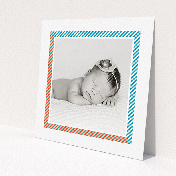 A new baby announcement card template titled 'Kensington Square'. It is a square (148mm x 148mm) card in a square orientation. It is a photographic new baby announcement card with room for 1 photo. 'Kensington Square' is available as a flat card, with tones of white, blue and red.