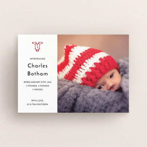 A new baby announcement card named "Onesie". It is an A6 card in a landscape orientation. It is a photographic new baby announcement card with room for 1 photo. "Onesie" is available as a flat card, with tones of white and red.