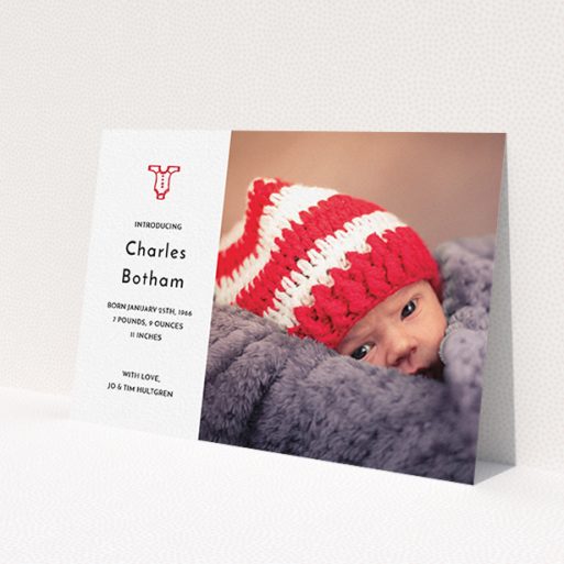 A new baby announcement card named 'Onesie'. It is an A6 card in a landscape orientation. It is a photographic new baby announcement card with room for 1 photo. 'Onesie' is available as a flat card, with tones of white and red.