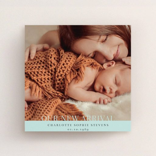 A new baby announcement card named "Our New Arrival". It is a square (148mm x 148mm) card in a square orientation. It is a photographic new baby announcement card with room for 1 photo. "Our New Arrival" is available as a flat card, with mainly blue colouring.