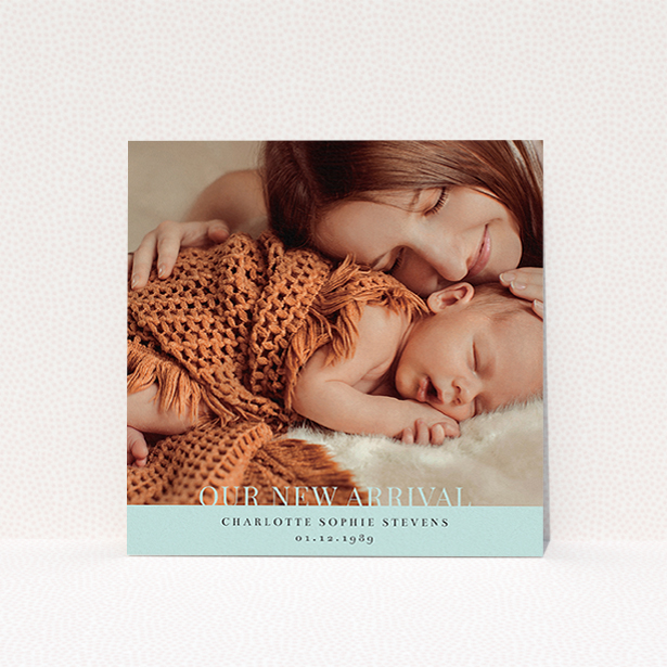 A new baby announcement card named "Our New Arrival". It is a square (148mm x 148mm) card in a square orientation. It is a photographic new baby announcement card with room for 1 photo. "Our New Arrival" is available as a flat card, with mainly blue colouring.