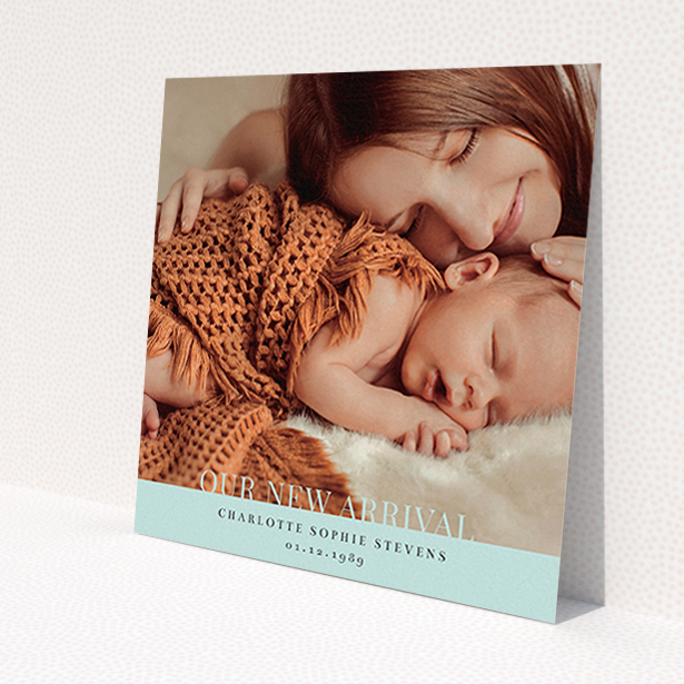 A new baby announcement card named 'Our New Arrival'. It is a square (148mm x 148mm) card in a square orientation. It is a photographic new baby announcement card with room for 1 photo. 'Our New Arrival' is available as a flat card, with mainly blue colouring.