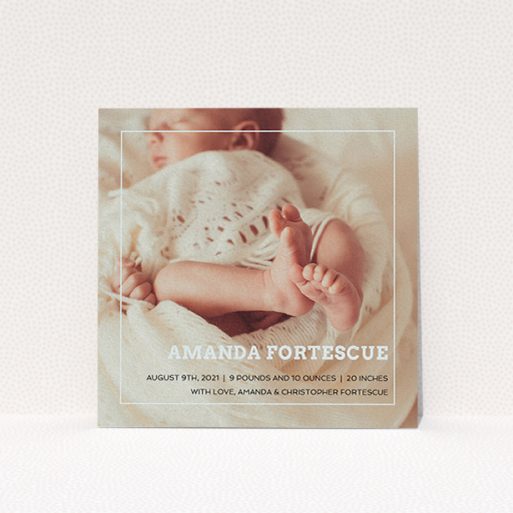 A new baby announcement card named "Over Photo Frame". It is a square (148mm x 148mm) card in a square orientation. It is a photographic new baby announcement card with room for 1 photo. "Over Photo Frame" is available as a flat card, with mainly light blue colouring.