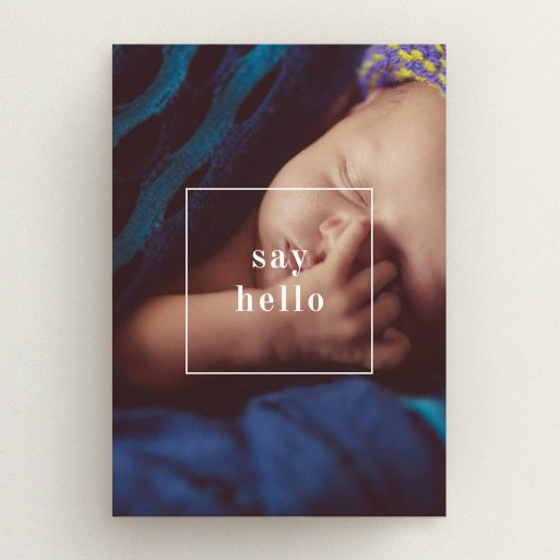 A new baby announcement card template titled "Say Hello". It is an A5 card in a portrait orientation. It is a photographic new baby announcement card with room for 1 photo. "Say Hello" is available as a flat card, with mainly white colouring.