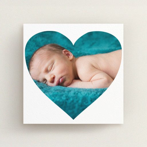 A new baby announcement card design titled "Simple Heart Frame". It is a square (148mm x 148mm) card in a square orientation. It is a photographic new baby announcement card with room for 1 photo. "Simple Heart Frame" is available as a flat card, with mainly white colouring.