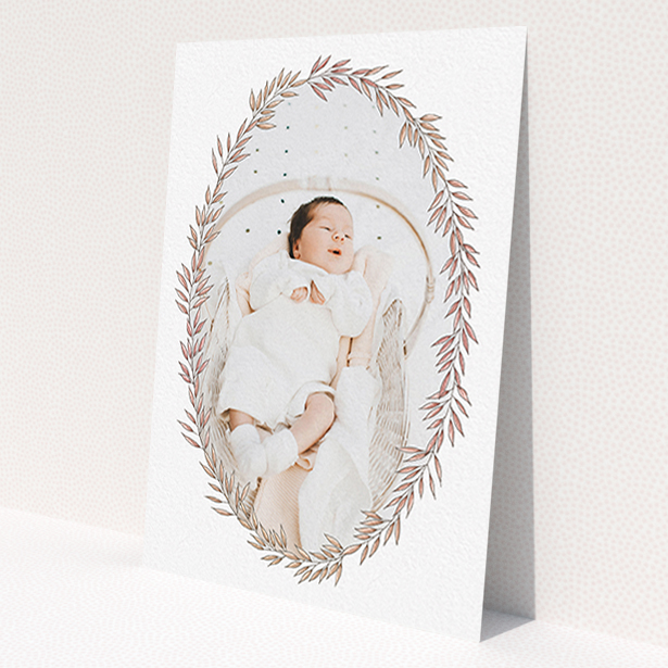 A new baby announcement card design titled 'Tussled Wreath'. It is an A6 card in a portrait orientation. It is a photographic new baby announcement card with room for 1 photo. 'Tussled Wreath' is available as a flat card, with tones of pink and white.