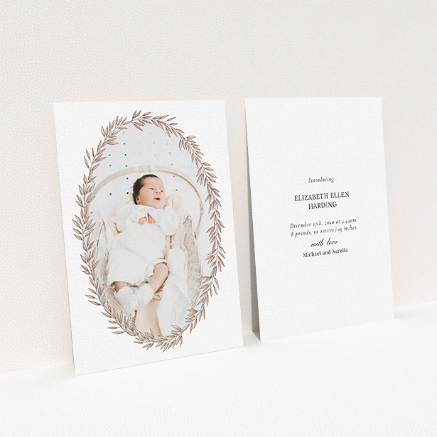 A new baby announcement card design titled "Tussled Wreath". It is an A6 card in a portrait orientation. It is a photographic new baby announcement card with room for 1 photo. "Tussled Wreath" is available as a flat card, with tones of pink and white.