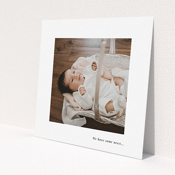 A new baby announcement card called 'We have some news'. It is a square (148mm x 148mm) card in a square orientation. It is a photographic new baby announcement card with room for 1 photo. 'We have some news' is available as a flat card, with mainly white colouring.