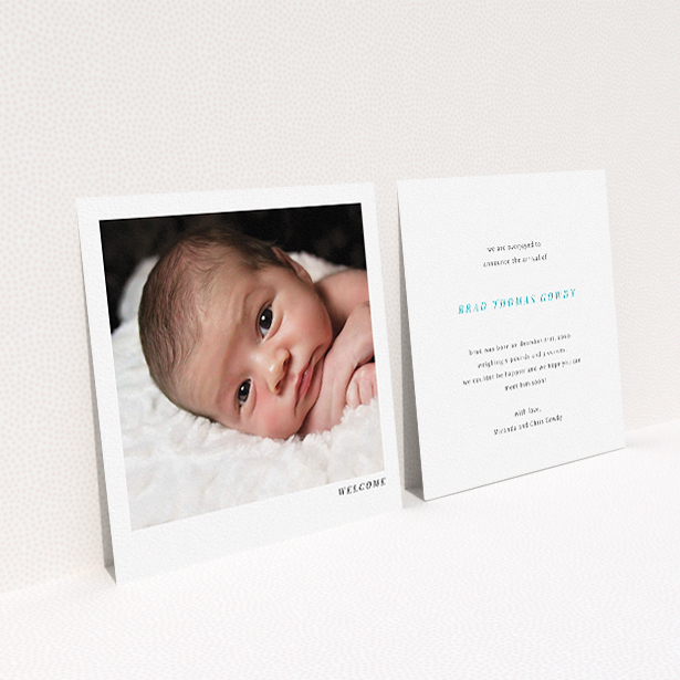 A new baby announcement card named "Welcome". It is a square (148mm x 148mm) card in a square orientation. It is a photographic new baby announcement card with room for 1 photo. "Welcome" is available as a flat card, with mainly white colouring.