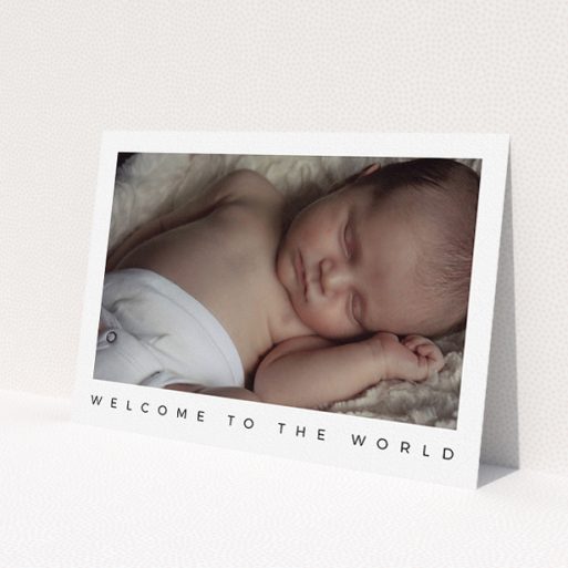 A new baby announcement card named 'Welcome to the World'. It is an A5 card in a landscape orientation. It is a photographic new baby announcement card with room for 1 photo. 'Welcome to the World' is available as a flat card, with mainly white colouring.