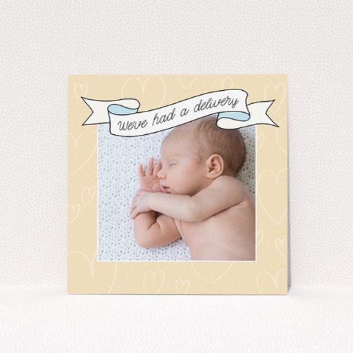 A new baby announcement card named "Written Above". It is a square (148mm x 148mm) card in a square orientation. It is a photographic new baby announcement card with room for 1 photo. "Written Above" is available as a flat card, with tones of faded yellow and light blue.