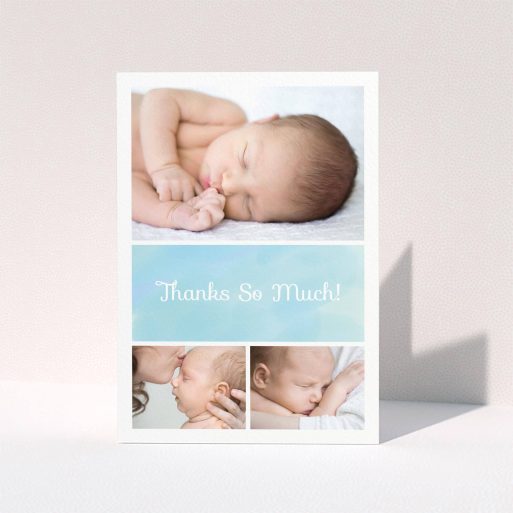 A new baby thank you card design titled "Block Tower". It is an A5 card in a portrait orientation. It is a photographic new baby thank you card with room for 3 photos. "Block Tower" is available as a folded card, with tones of blue and white.