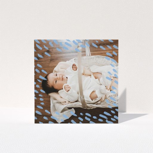 A new baby thank you card named "Blue Daubs". It is a square (148mm x 148mm) card in a square orientation. It is a photographic new baby thank you card with room for 1 photo. "Blue Daubs" is available as a folded card, with mainly blue colouring.