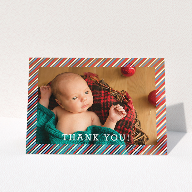 A new baby thank you card design titled "Blue, Red and White Slant". It is an A5 card in a landscape orientation. It is a photographic new baby thank you card with room for 1 photo. "Blue, Red and White Slant" is available as a folded card, with mainly red colouring.