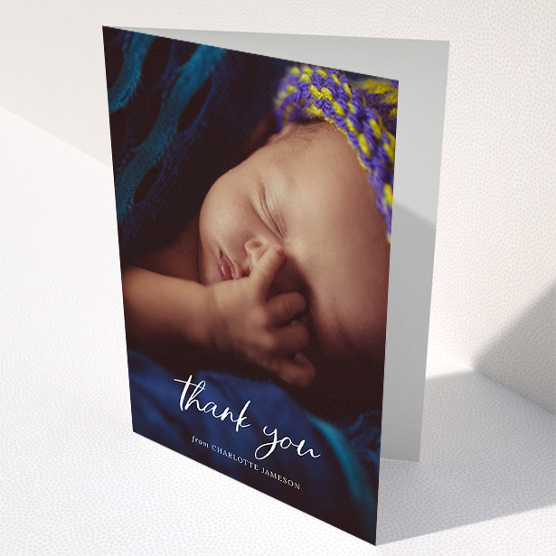 A new baby thank you card design titled "Calligraphy Thanks". It is an A5 card in a portrait orientation. It is a photographic new baby thank you card with room for 1 photo. "Calligraphy Thanks" is available as a folded card, with mainly white colouring.
