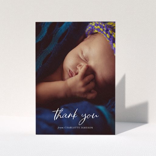 A new baby thank you card template titled "Calligraphy Thanks". It is an A6 card in a portrait orientation. It is a photographic new baby thank you card with room for 1 photo. "Calligraphy Thanks" is available as a folded card, with mainly white colouring.