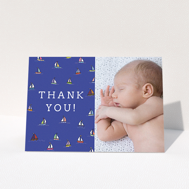 A new baby thank you card named "Cowes Week". It is an A6 card in a landscape orientation. It is a photographic new baby thank you card with room for 1 photo. "Cowes Week" is available as a folded card, with mainly blue colouring.