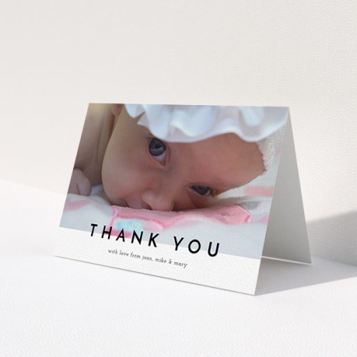 A new baby thank you card named 'Cross Border'. It is an A6 card in a landscape orientation. It is a photographic new baby thank you card with room for 1 photo. 'Cross Border' is available as a folded card, with mainly white colouring.