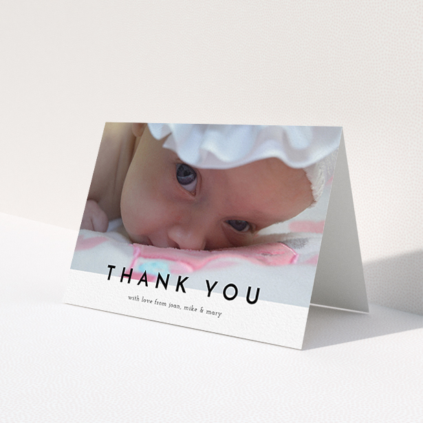 A new baby thank you card named "Cross Border". It is an A6 card in a landscape orientation. It is a photographic new baby thank you card with room for 1 photo. "Cross Border" is available as a folded card, with mainly white colouring.