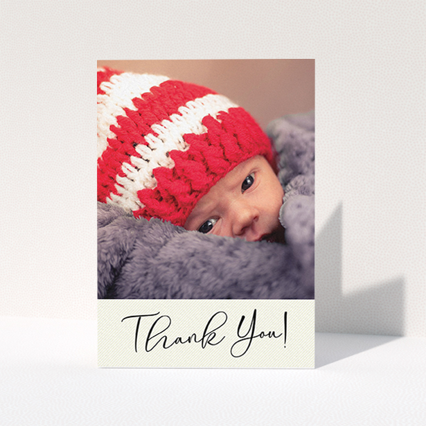 A new baby thank you card called "Cursive Thanks". It is an A6 card in a portrait orientation. It is a photographic new baby thank you card with room for 1 photo. "Cursive Thanks" is available as a folded card, with mainly cream colouring.