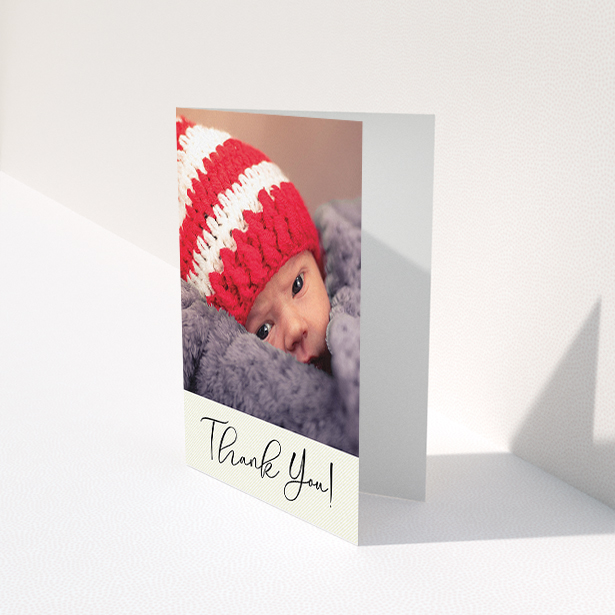 A new baby thank you card called "Cursive Thanks". It is an A6 card in a portrait orientation. It is a photographic new baby thank you card with room for 1 photo. "Cursive Thanks" is available as a folded card, with mainly cream colouring.