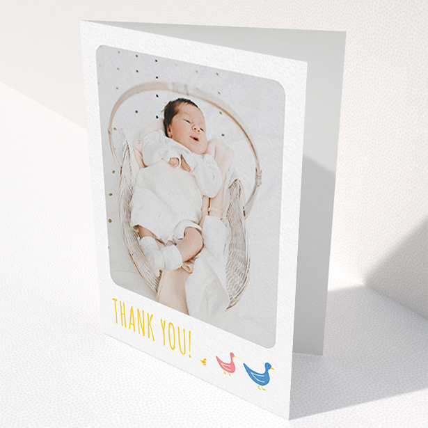 A new baby thank you card design named "Family of Ducks". It is an A6 card in a portrait orientation. It is a photographic new baby thank you card with room for 1 photo. "Family of Ducks" is available as a folded card, with tones of white, blue and pink.