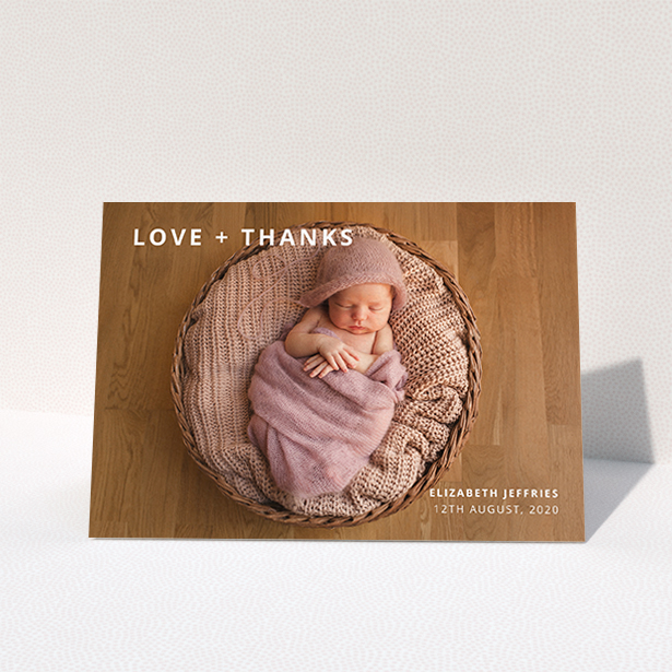 A new baby thank you card design called "Love and Thanks Landscape". It is an A6 card in a landscape orientation. It is a photographic new baby thank you card with room for 1 photo. "Love and Thanks Landscape" is available as a folded card, with mainly white colouring.