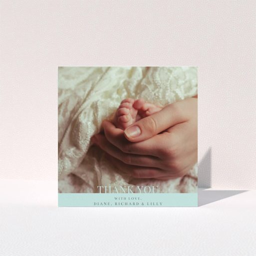 A new baby thank you card design named "Mint Blue Bottom Banner". It is a square (148mm x 148mm) card in a square orientation. It is a photographic new baby thank you card with room for 1 photo. "Mint Blue Bottom Banner" is available as a folded card, with mainly blue colouring.