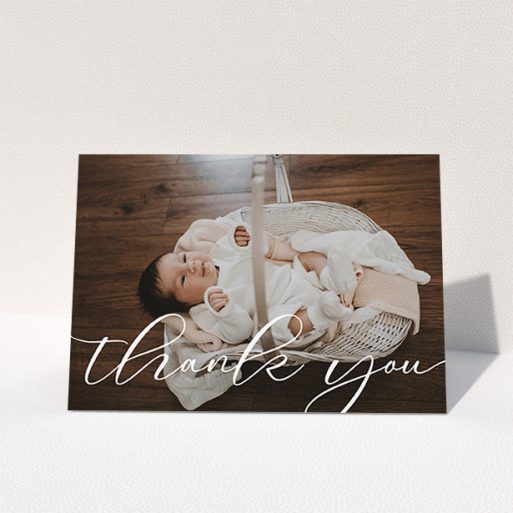 A new baby thank you card template titled "One Photo". It is an A6 card in a landscape orientation. It is a photographic new baby thank you card with room for 1 photo. "One Photo" is available as a folded card, with mainly white colouring.