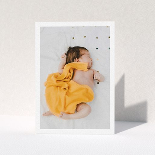 A new baby thank you card design titled "One Photo Thanks". It is an A6 card in a portrait orientation. It is a photographic new baby thank you card with room for 1 photo. "One Photo Thanks" is available as a folded card, with mainly white colouring.