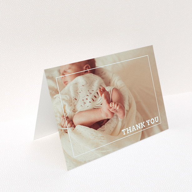 A new baby thank you card design named "Over Photo Frame". It is an A6 card in a landscape orientation. It is a photographic new baby thank you card with room for 1 photo. "Over Photo Frame" is available as a folded card, with mainly white colouring.