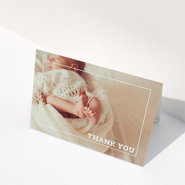 A new baby thank you card design named "Over Photo Frame". It is an A6 card in a landscape orientation. It is a photographic new baby thank you card with room for 1 photo. "Over Photo Frame" is available as a folded card, with mainly white colouring.